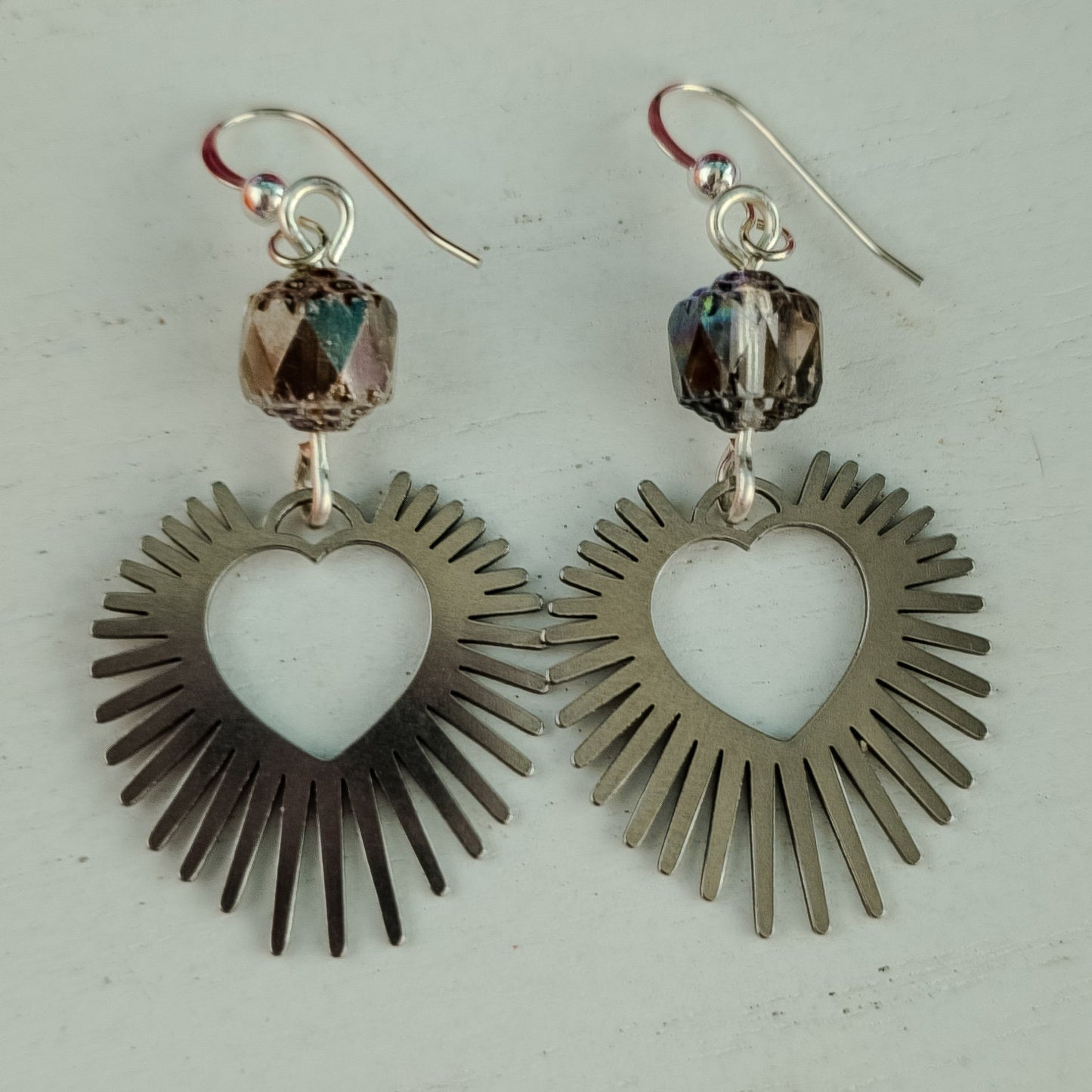 Statement Earrings: Bold Silver & Crystal Hearts.